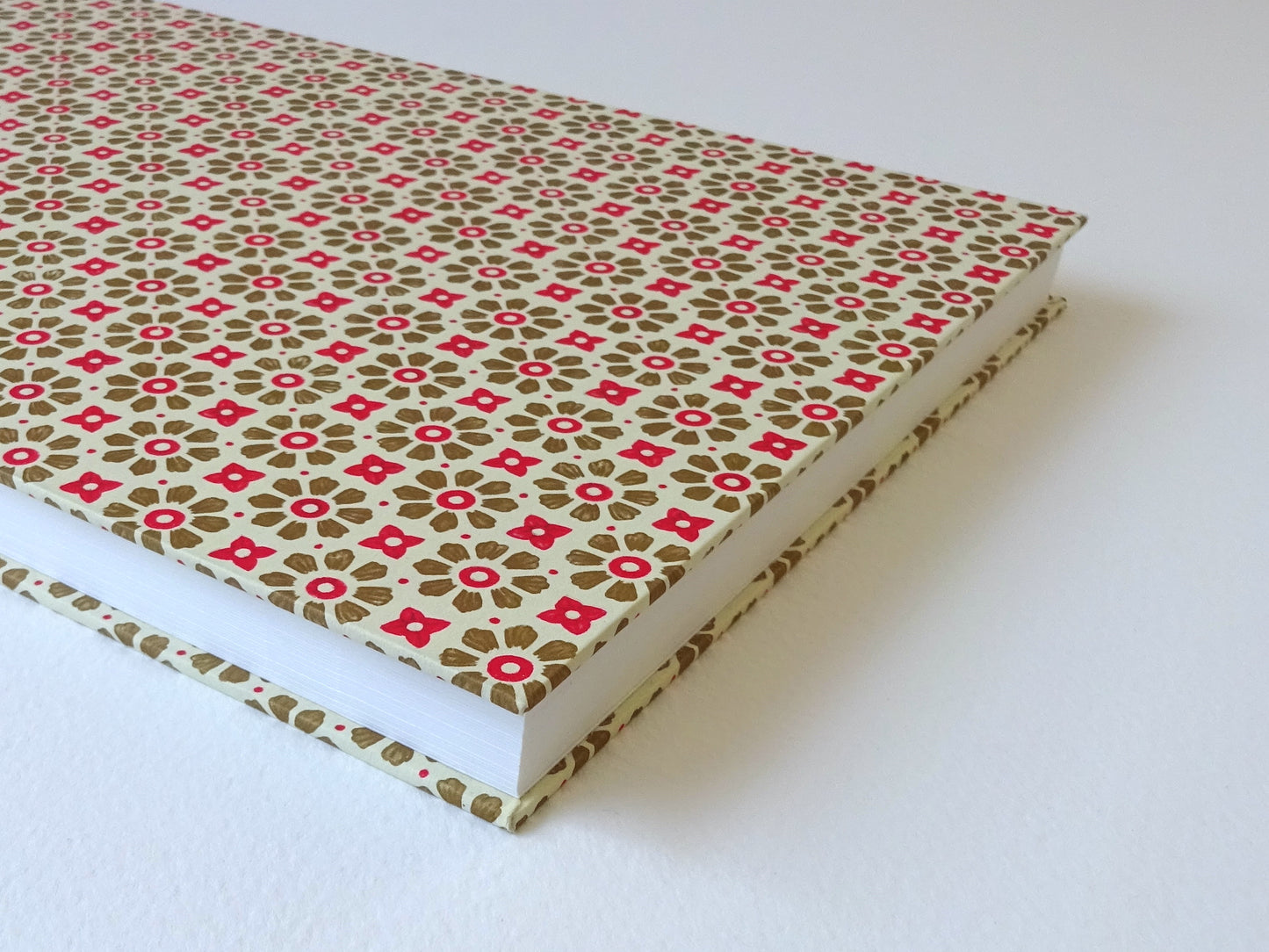 large hand bound watercolour sketchbook with green and red Italian pattern paper foredge detail