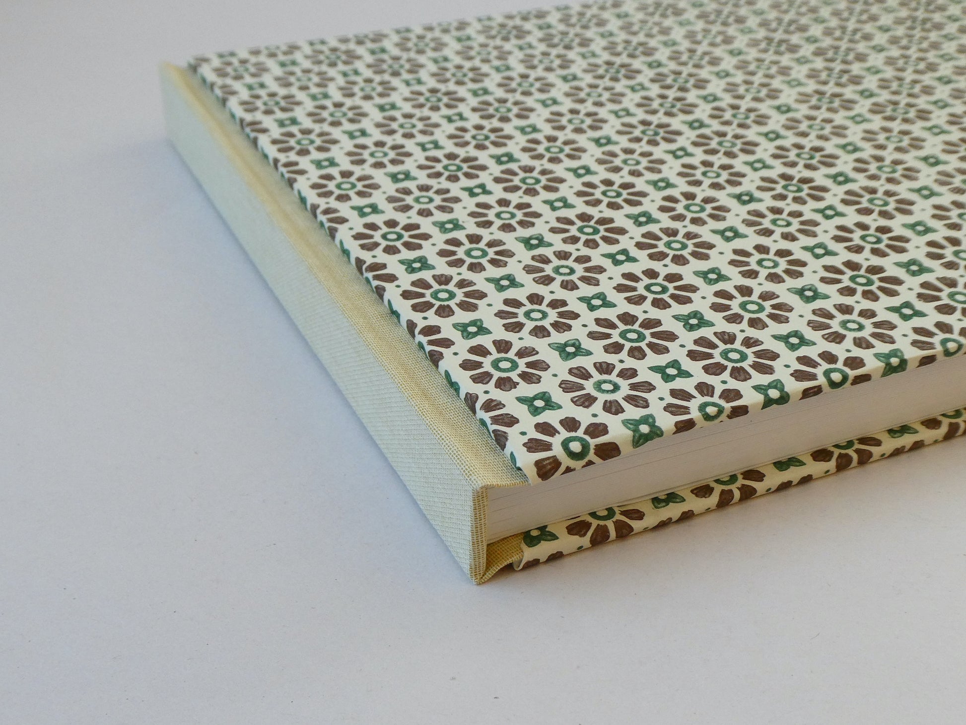 Handmade sketchbook with a patterned cover on a white background