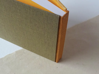 three colours square hand bound sketchbook mustard standing