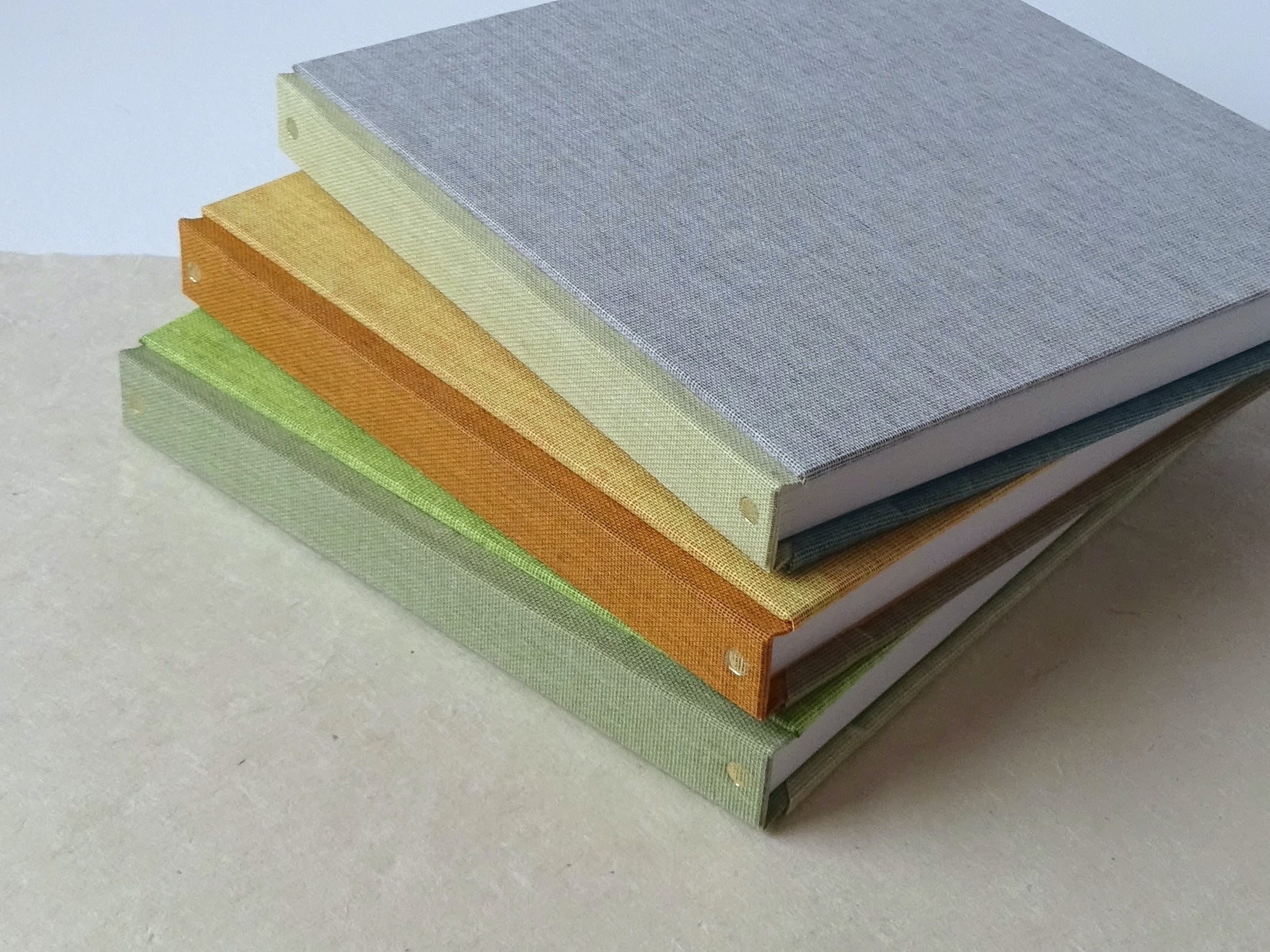 3 three colours square sketchbooks with gold tooling