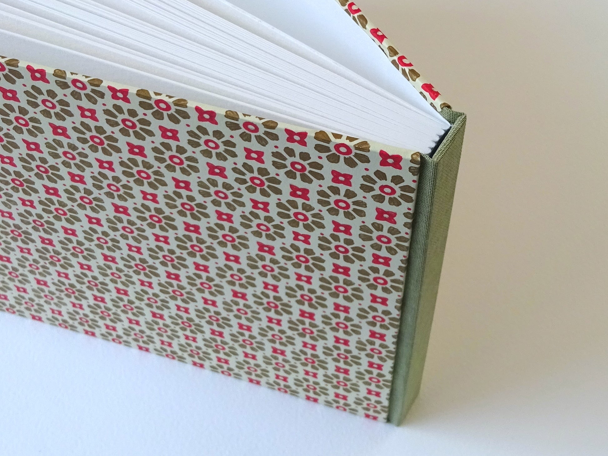 large hand bound watercolour sketchbook with green and red Italian pattern paper standing