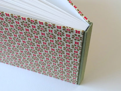 large hand bound watercolour sketchbook with green and red Italian pattern paper standing
