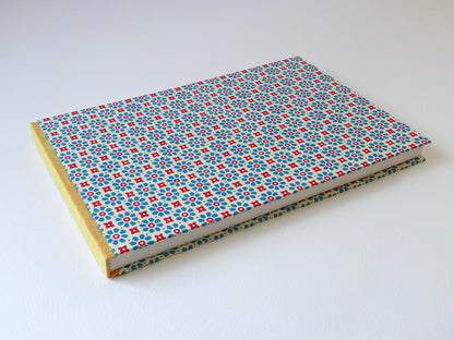 large hand bound watercolour sketchbook with Italian pattern paper lying flat