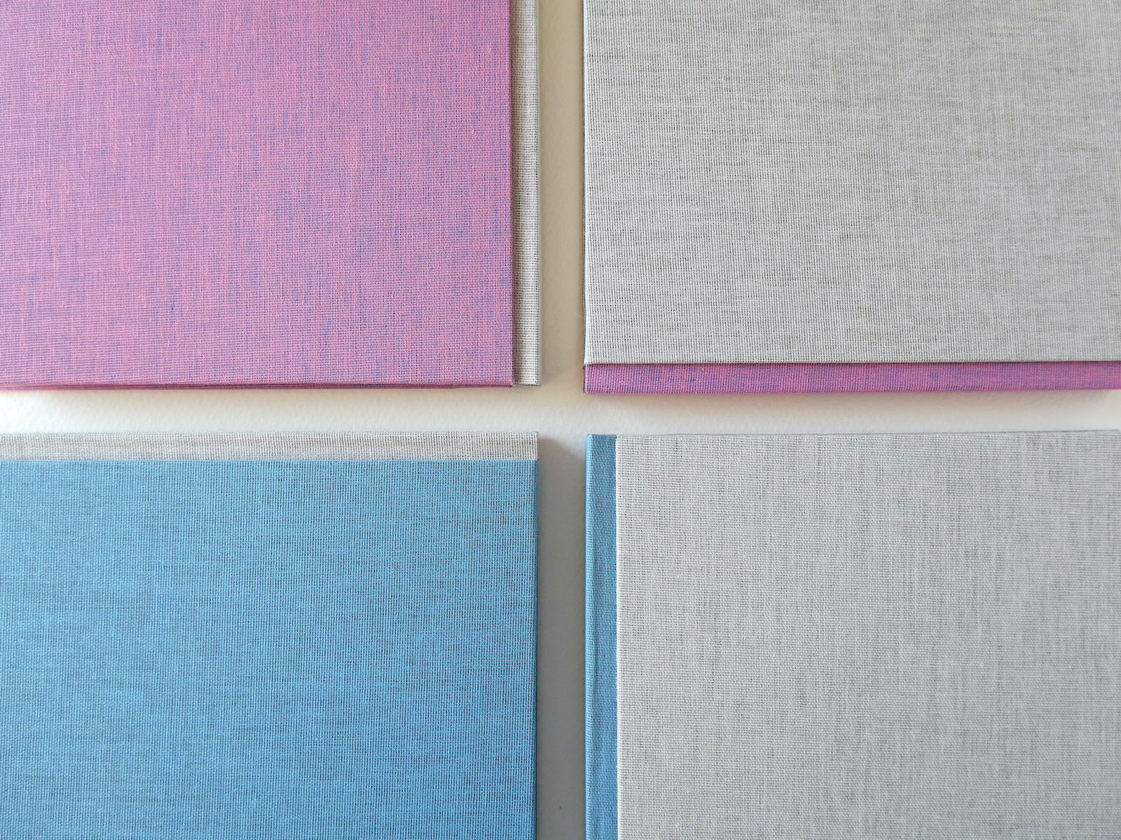 4 hand made sketchbooks in pink grey and blue