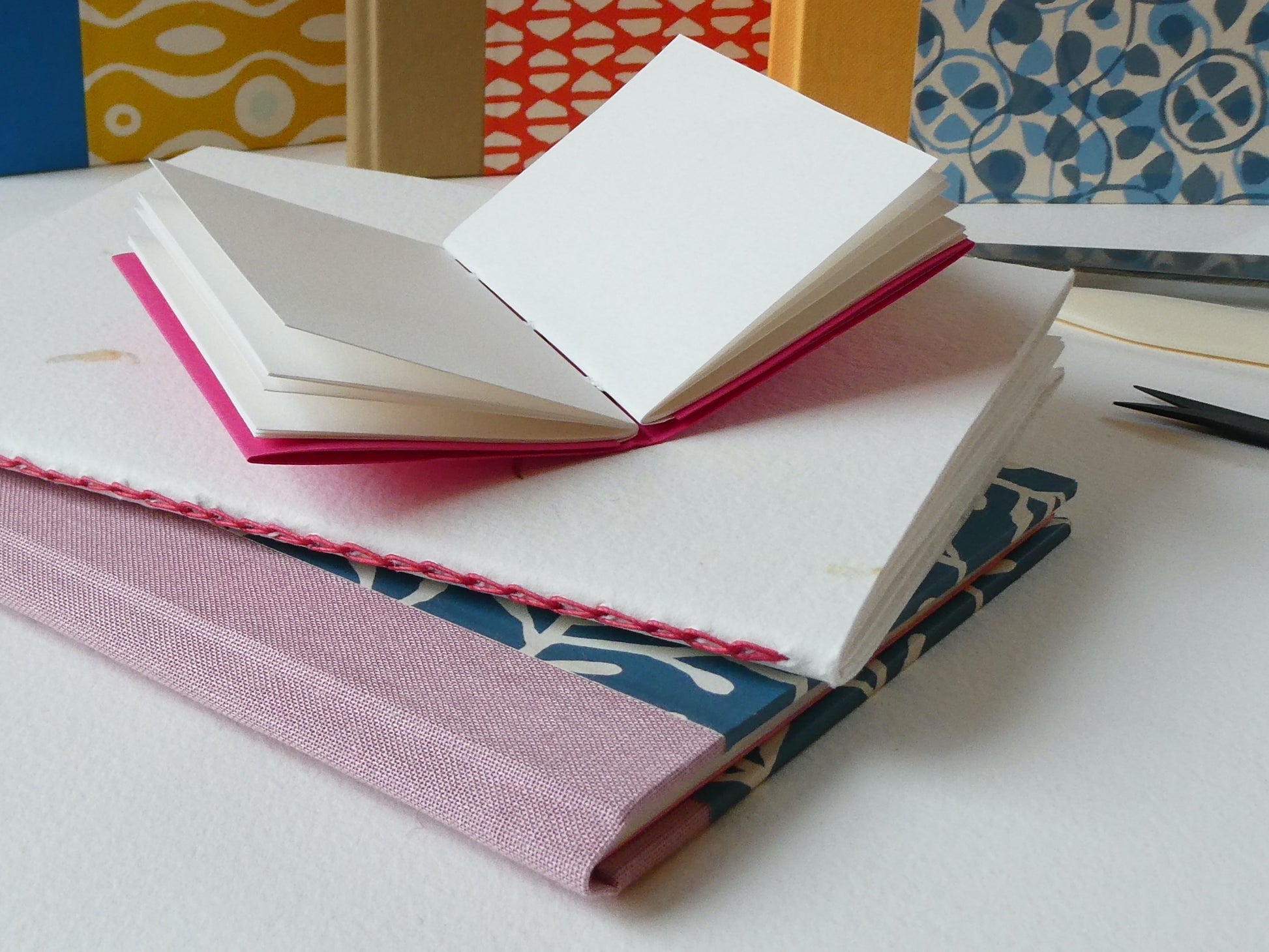 Three sewn notebooks bookbinding workshop