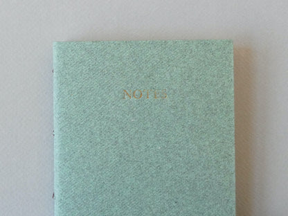 Celandine Books green notebook with gold lettering