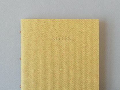 Celandine Books ochre yellow notebook with gold title