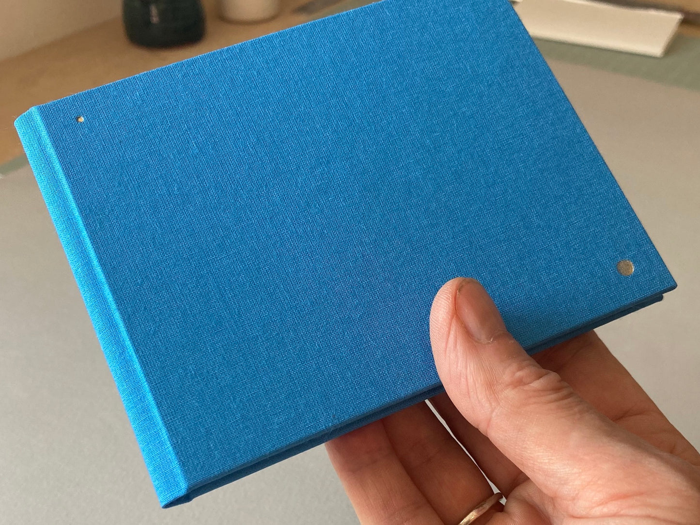 blue slim bright watercolour sketchbook in hand