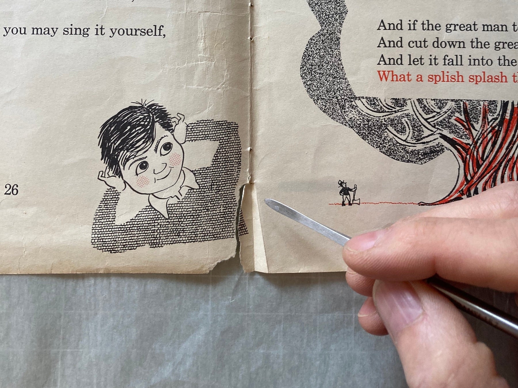 Torn page in children's book being repaired