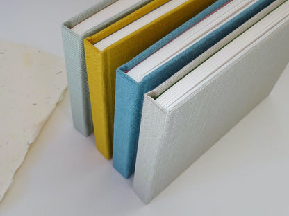 group of handmade linen sketchbooks