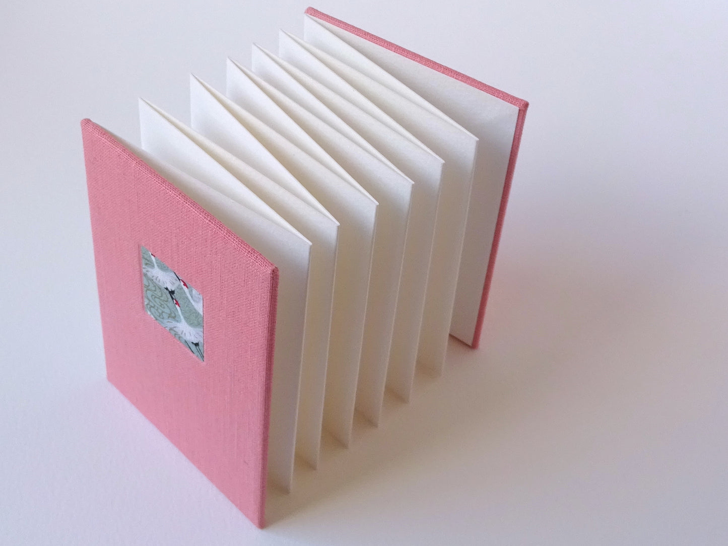 Celandine books coral pink linen concertina watercolour sketchbook with chiyogami standing