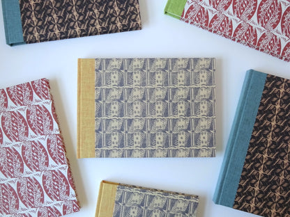 group of hand bound sketchbooks with enid marx pattern papers