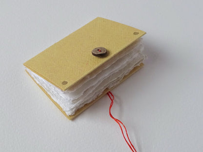 Ochre handmade paper mini book open foredge